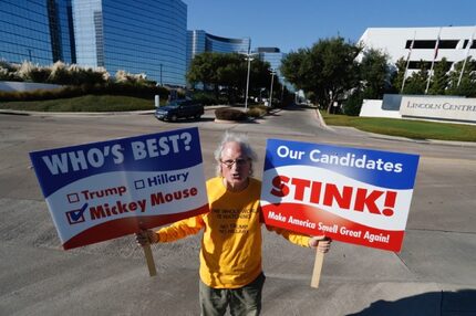 Tom Mitchell expresses himself outside a private fundraiser for Donald Trump in Dallas this...