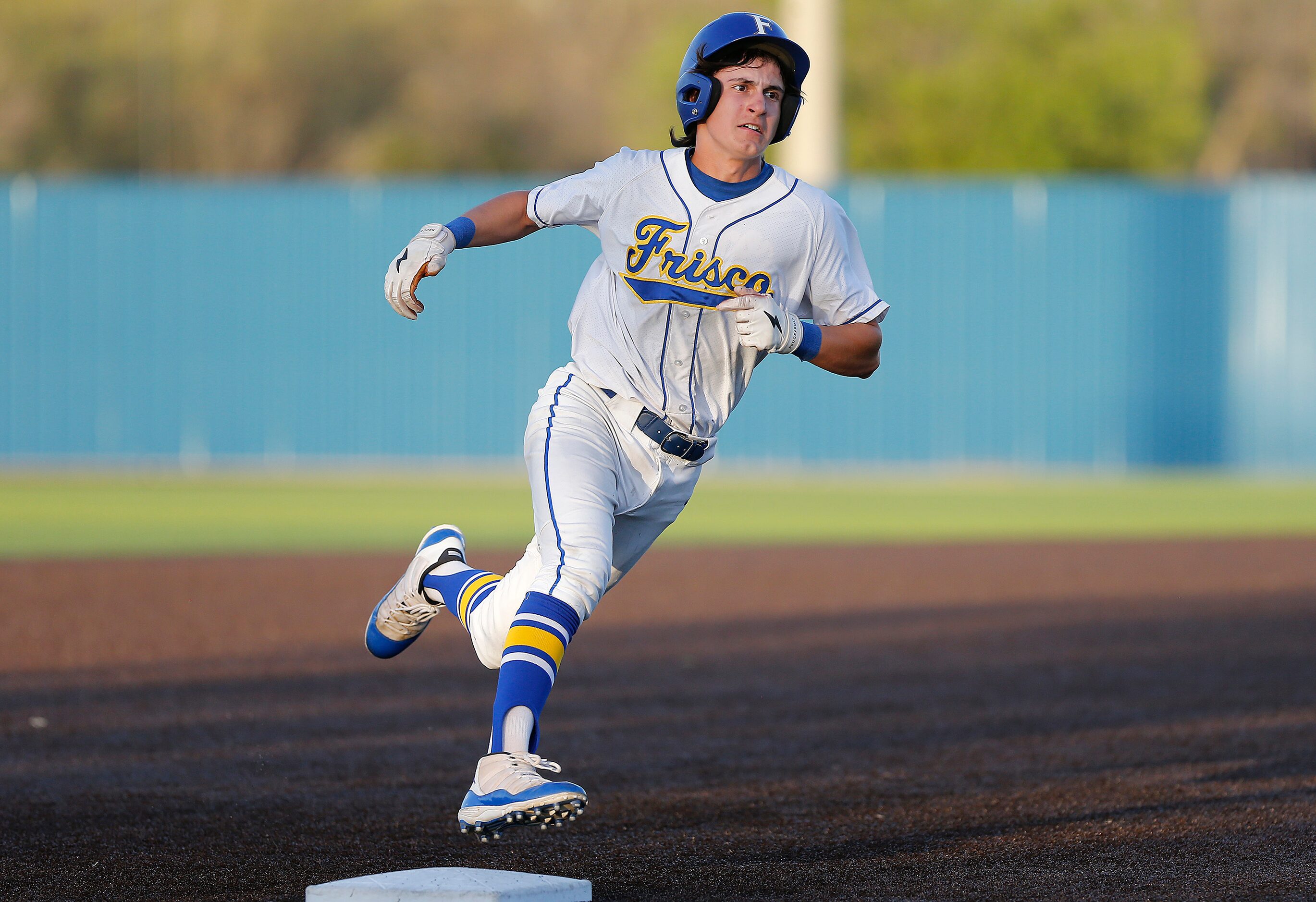 Frisco High School designated hitter Mihael Catalano (2) held up a third in the first inning...