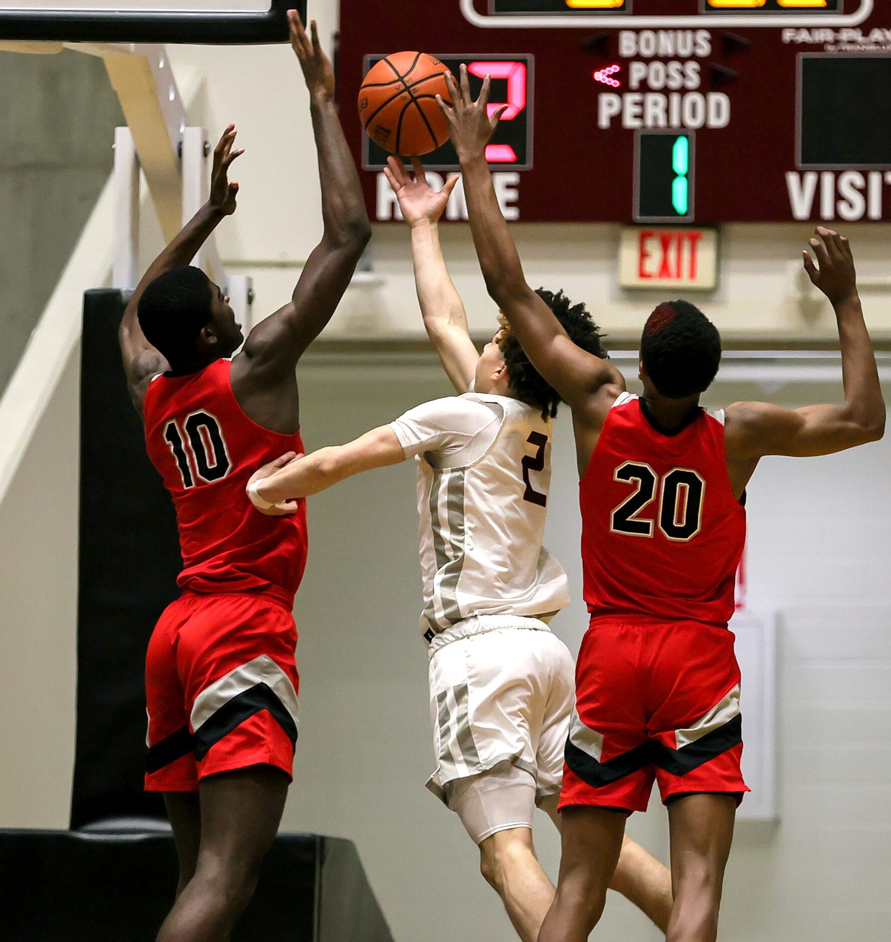 Plano guard Elijah Brown (2) tries to put up a shot against Lake Highland center Samson...