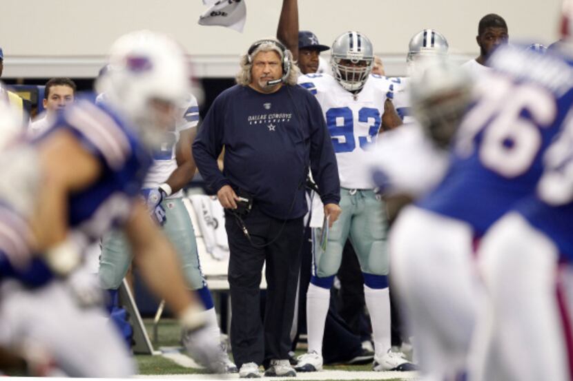 Dallas Cowboys defensive coordinator Rob Ryan watches a play develop during the first half...