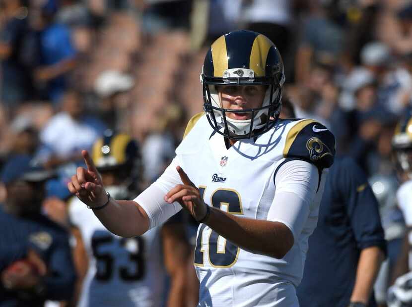 Los Angeles Rams quarterback Jared Goff calls to teammates during warmups before a preseason...