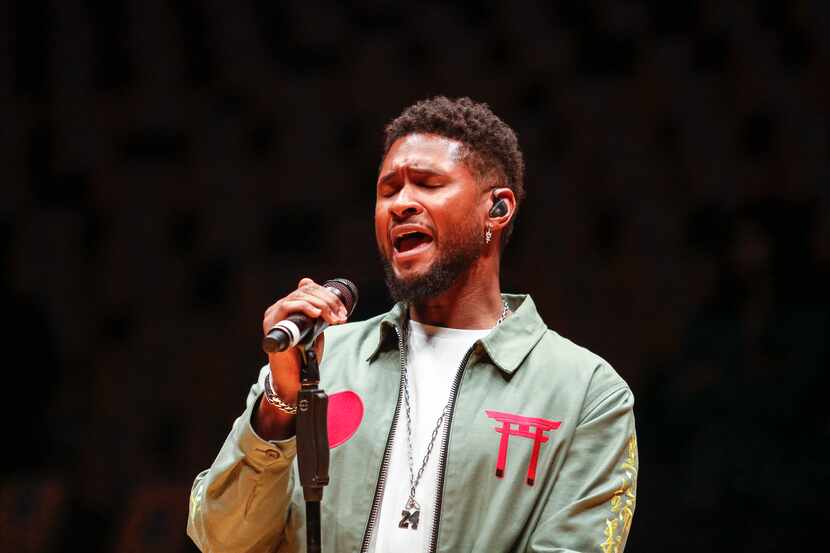 Singer Usher sings during a rehersal to honor the late Kobe Bryant prior to an NBA game...