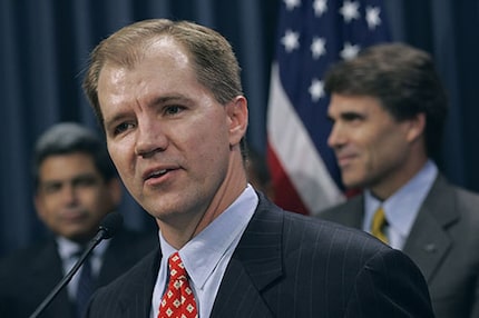 Don Willett, foreground, speaks after Texas Gov. Rick Perry, right, announced that Willett...