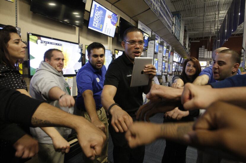 Carlos Portillo (center)  leads Best Buy workers in a cheer at a Burbank, Calif., store in...