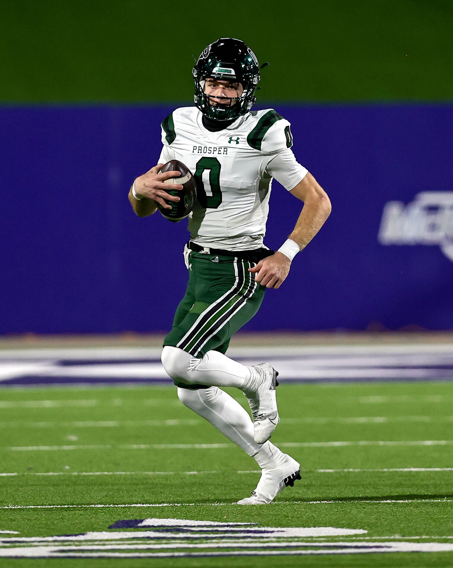 Prosper quarterback Nathan TenBarge scrambles against McKinney during the first half of a...