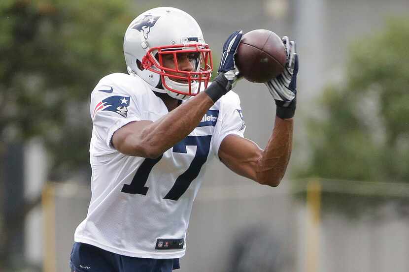 New England Patriots' Devin Street (17) catches a pass during an NFL football practice,...