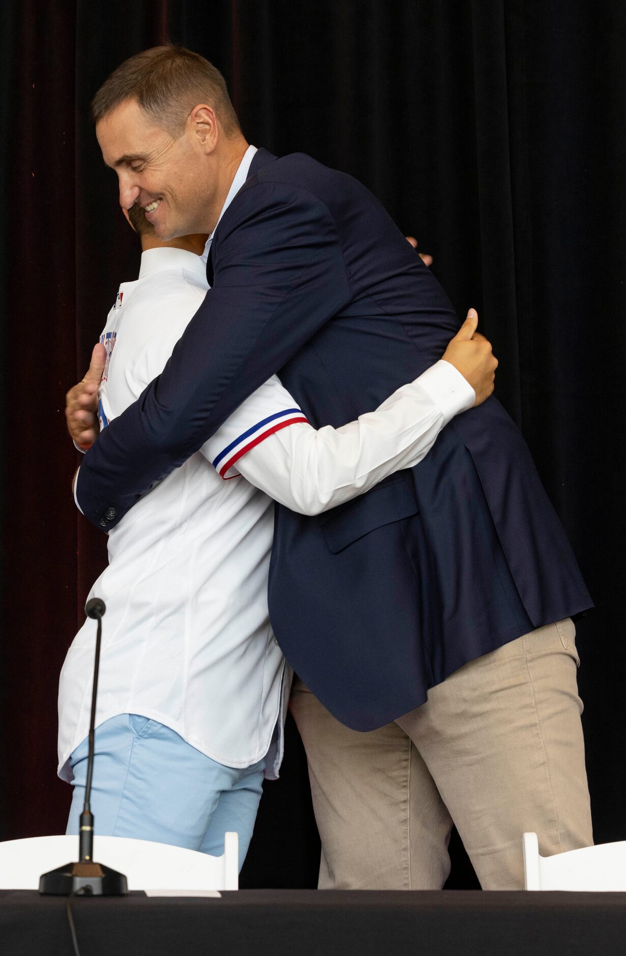 Chris Young, Rangers Executive Vice President and General Manager, congratulates Jack Leiter...