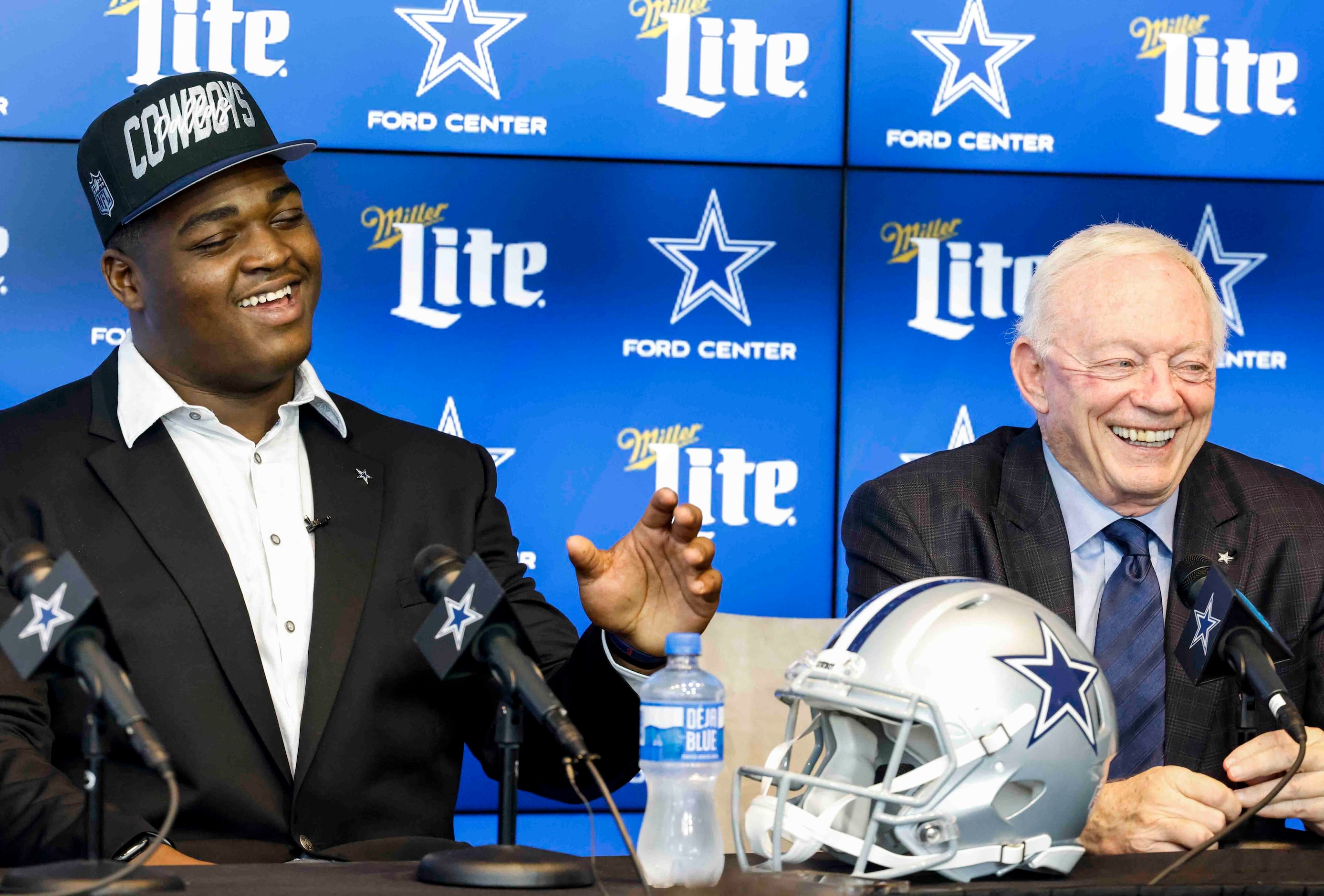 Dallas Cowboys first round draft pick Tyler Smith of Tulsa, left, and owner Jerry Jones...