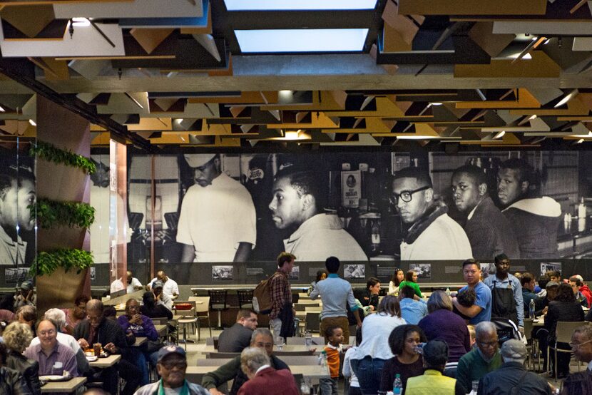 A photo mural of the Greensboro Four, who staged a 1960 sit-in at the F.W. Woolworth...