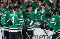 The Dallas Stars celebrate after a goal by center Joe Pavelski during the first period of...