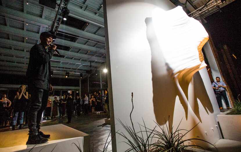 Artist Daneil Arsham was on hand Wednesday night as his sculpture, Moving Figure, was...