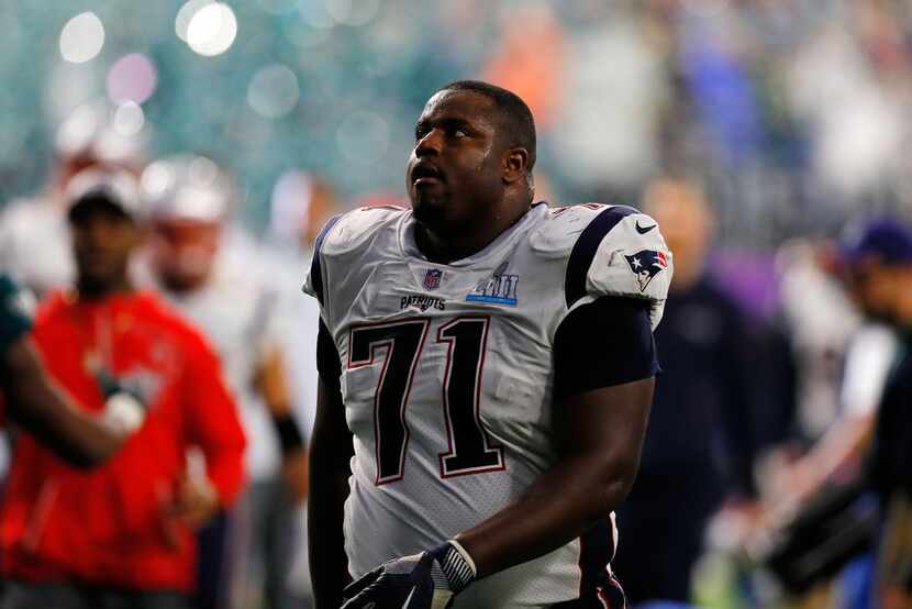 MINNEAPOLIS, MN - FEBRUARY 04: Cameron Fleming #71 of the New England Patriots walks off the...