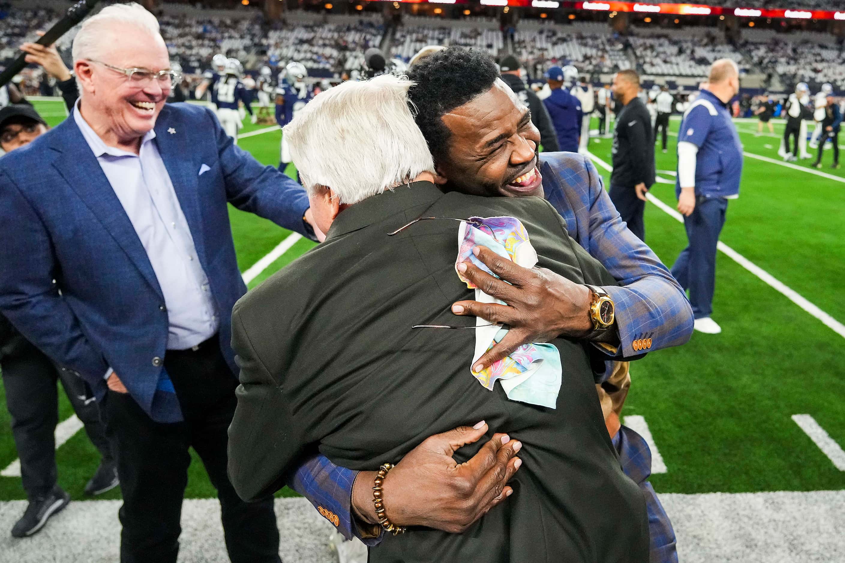 Former Dallas Cowboys player Michael Irvin hugs former coach Jimmy Johnson before an NFL...