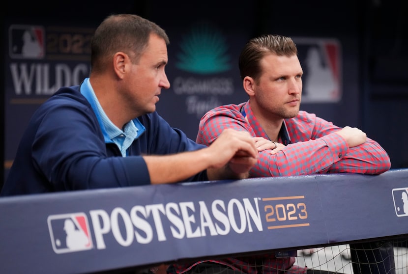 Texas Rangers general manager Chris Young (left) talks with assistant general manager Ross...