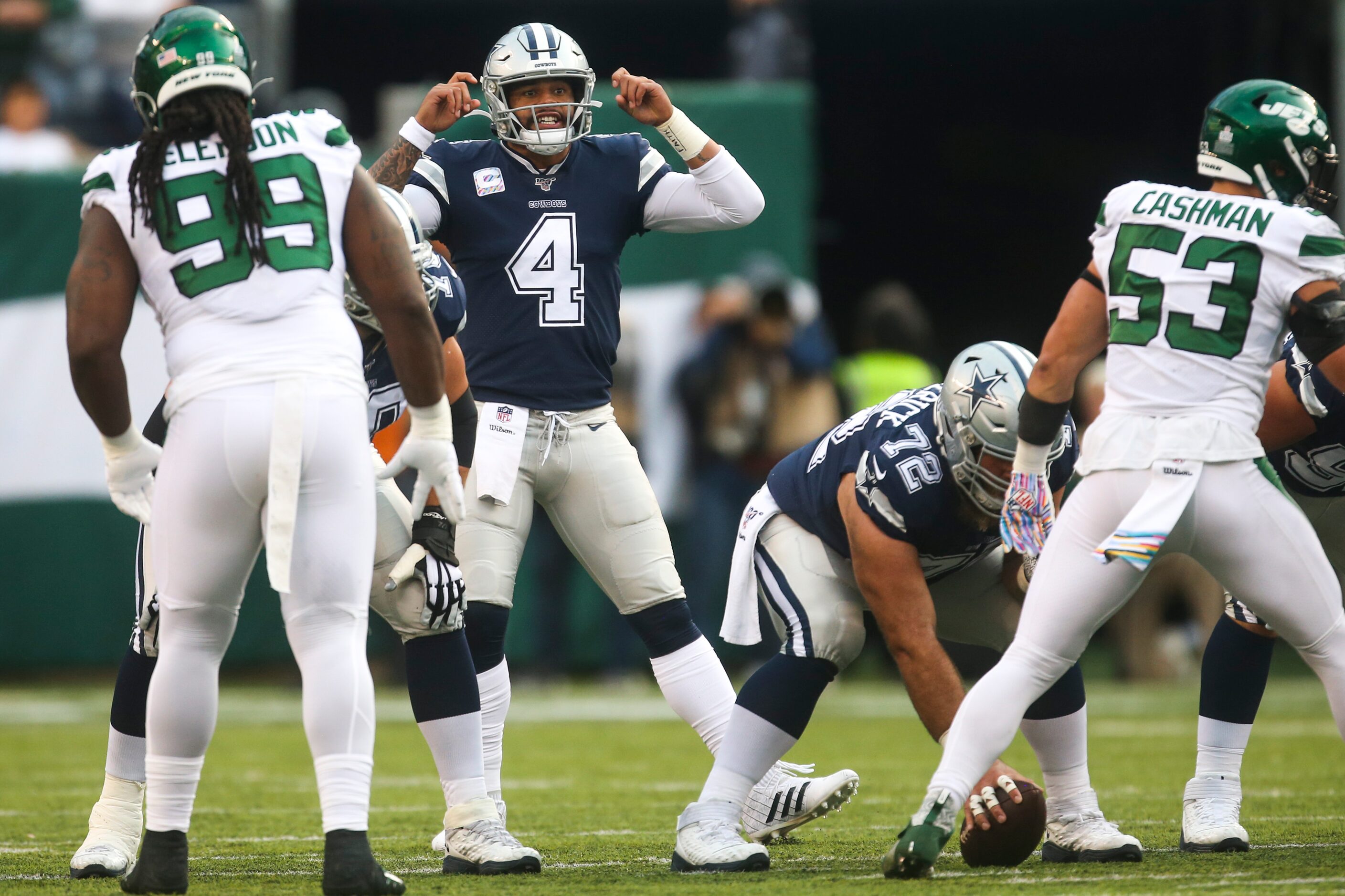 Dallas Cowboys quarterback Dak Prescott (4) makes an adjustment on the line during the first...