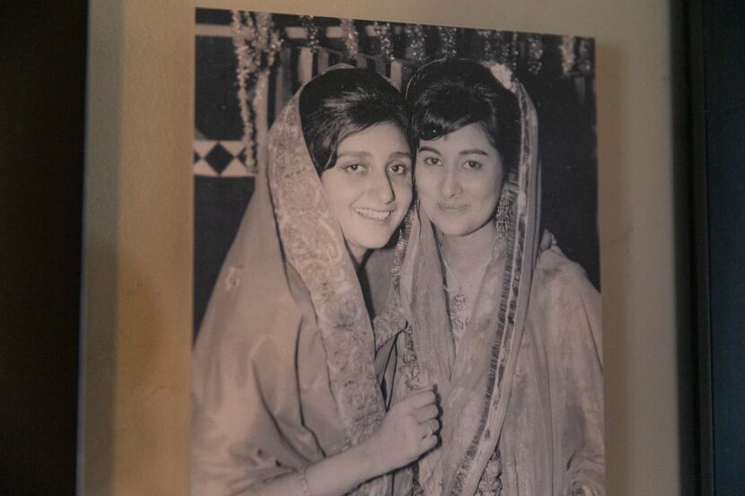 A photo of Ali Master's birth mother (right) and the aunt who adopted him hangs in his home...