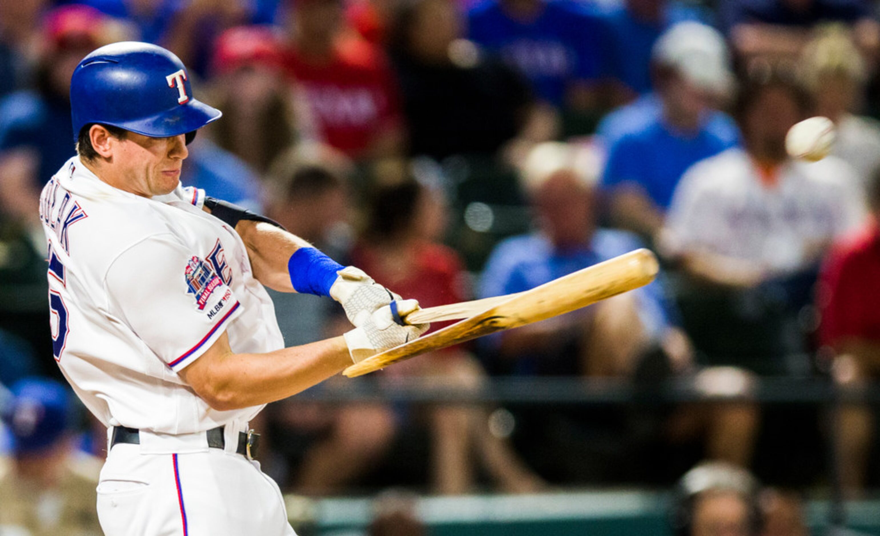 Texas Rangers second baseman Nick Solak (15) breaks a bat during the third inning of an MLB...