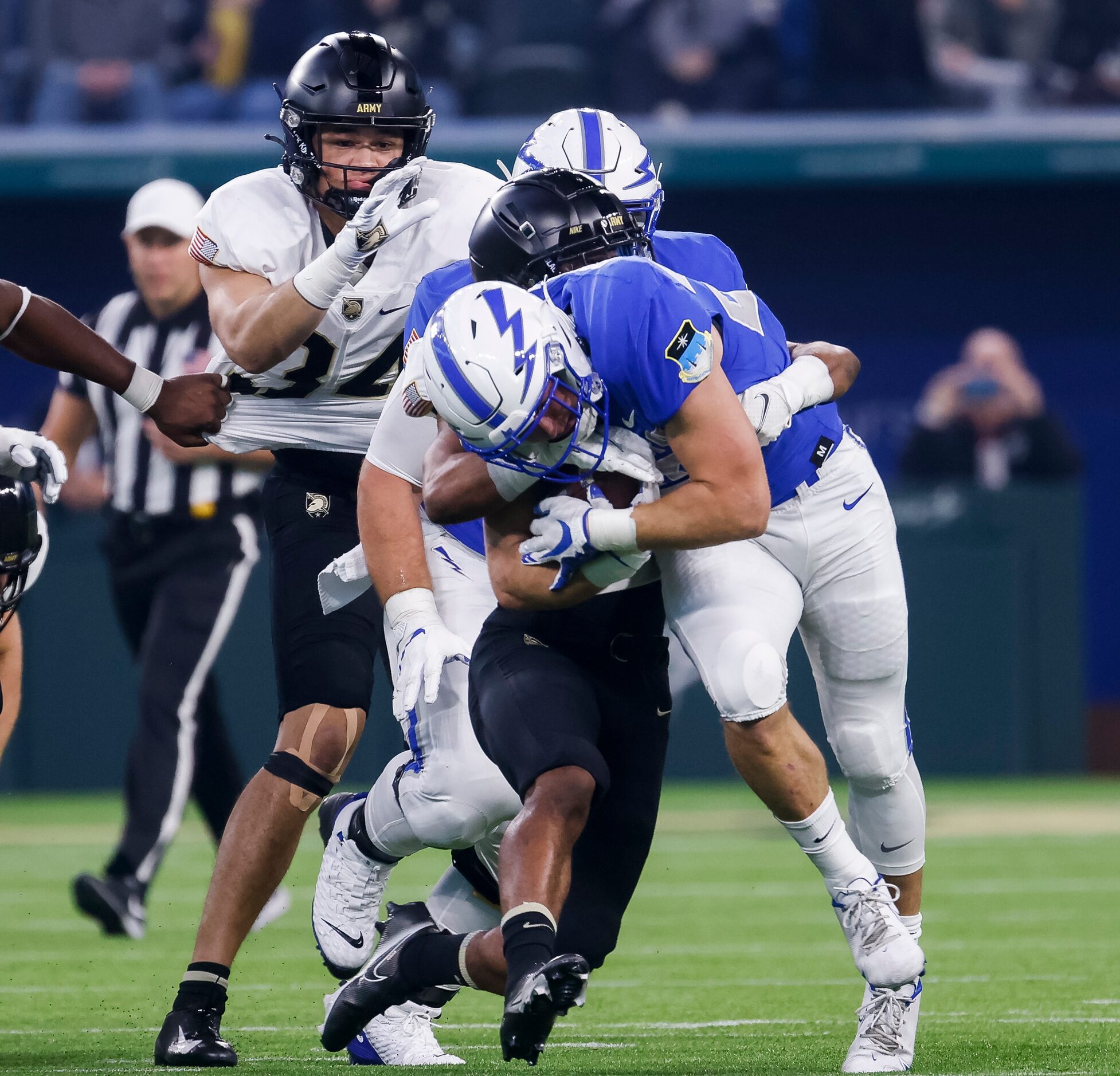 Army Black Knights cornerback Cameron Jones (10) tackles Air Force Falcons running back Brad...