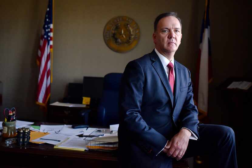 Judge John R. Roach, Jr., of the 296th District Court in McKinney in his chambers at the...