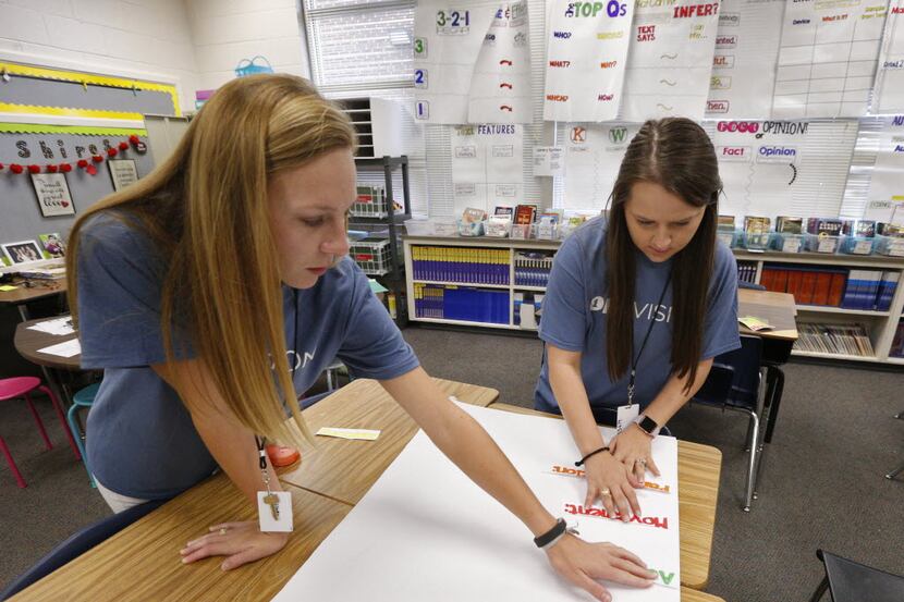 Michelle Krejci (left) and Elizabeth Shires, both first-year fifth-grade teachers, prepare...