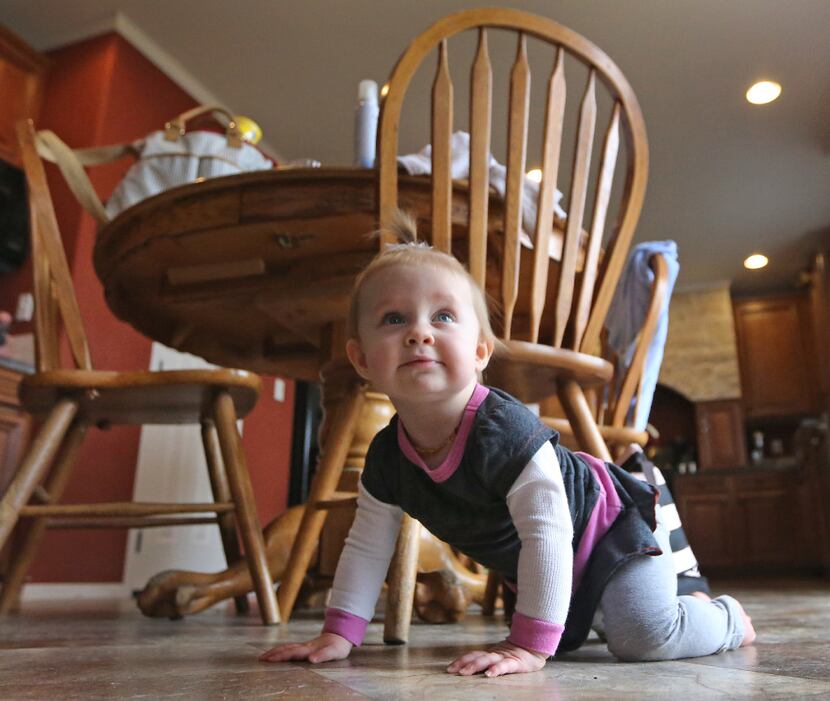 One-year-old Kelcey McKissack played at her grandmother's home in Nevada on Thursday. (Louis...
