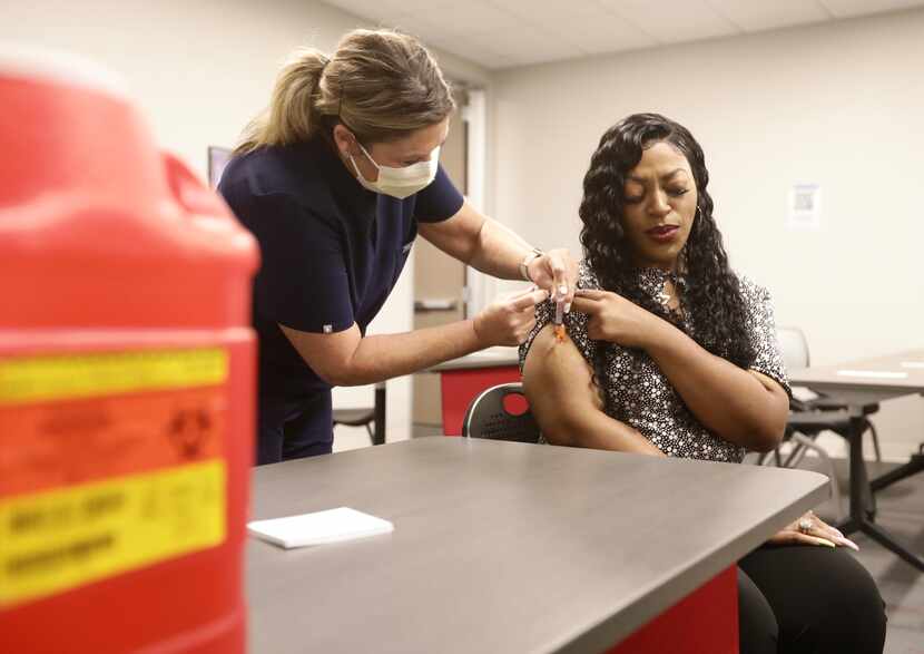 Terrei Killian administered a Johnson & Johnson vaccine to Ronyell Byers at the Workforce...