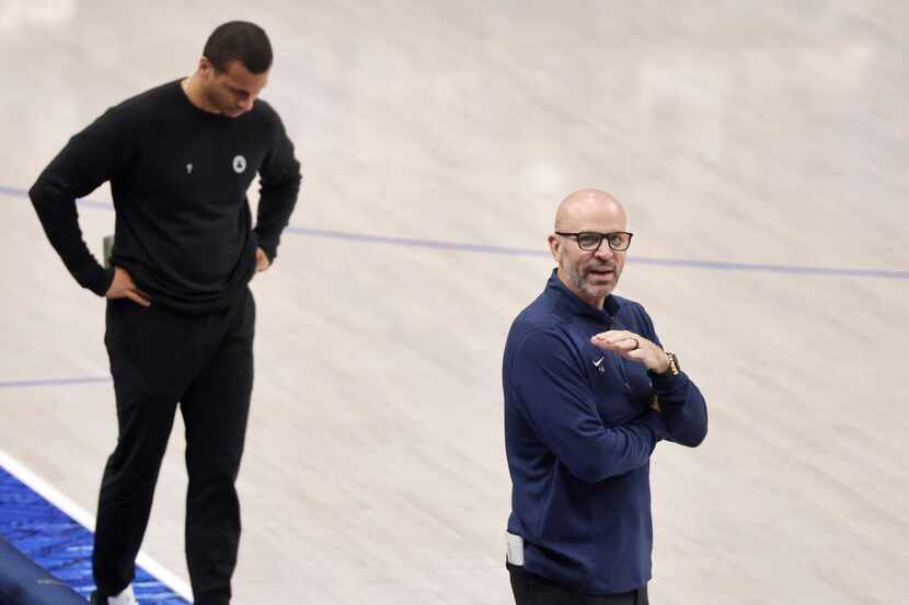 Dallas Mavericks head coach Jason Kidd gestures to the bench as Boston Celtics head coach...