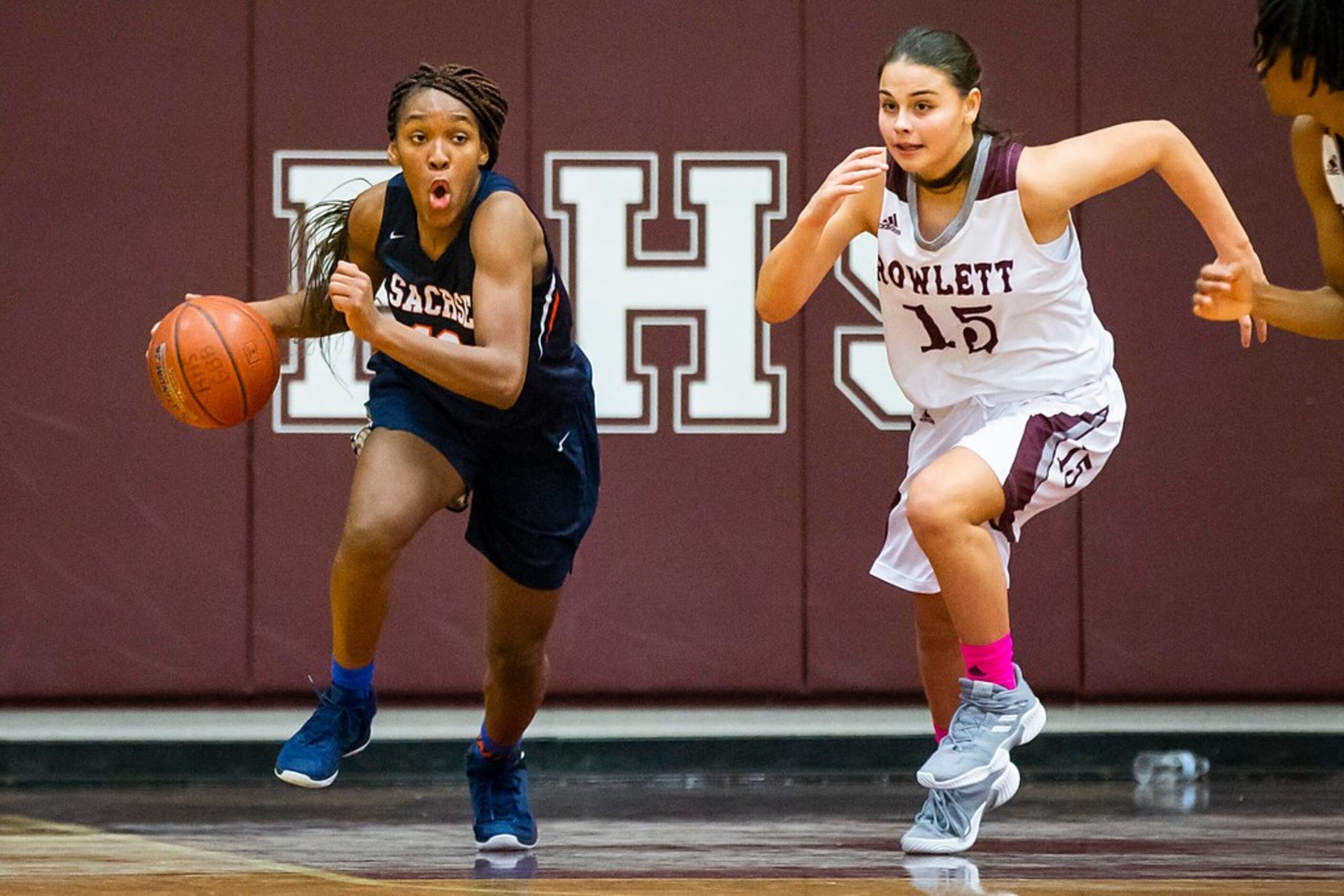 Sachse guard Tia Harvey (12) brings the ball up the floor against Rowlett guard Madi...