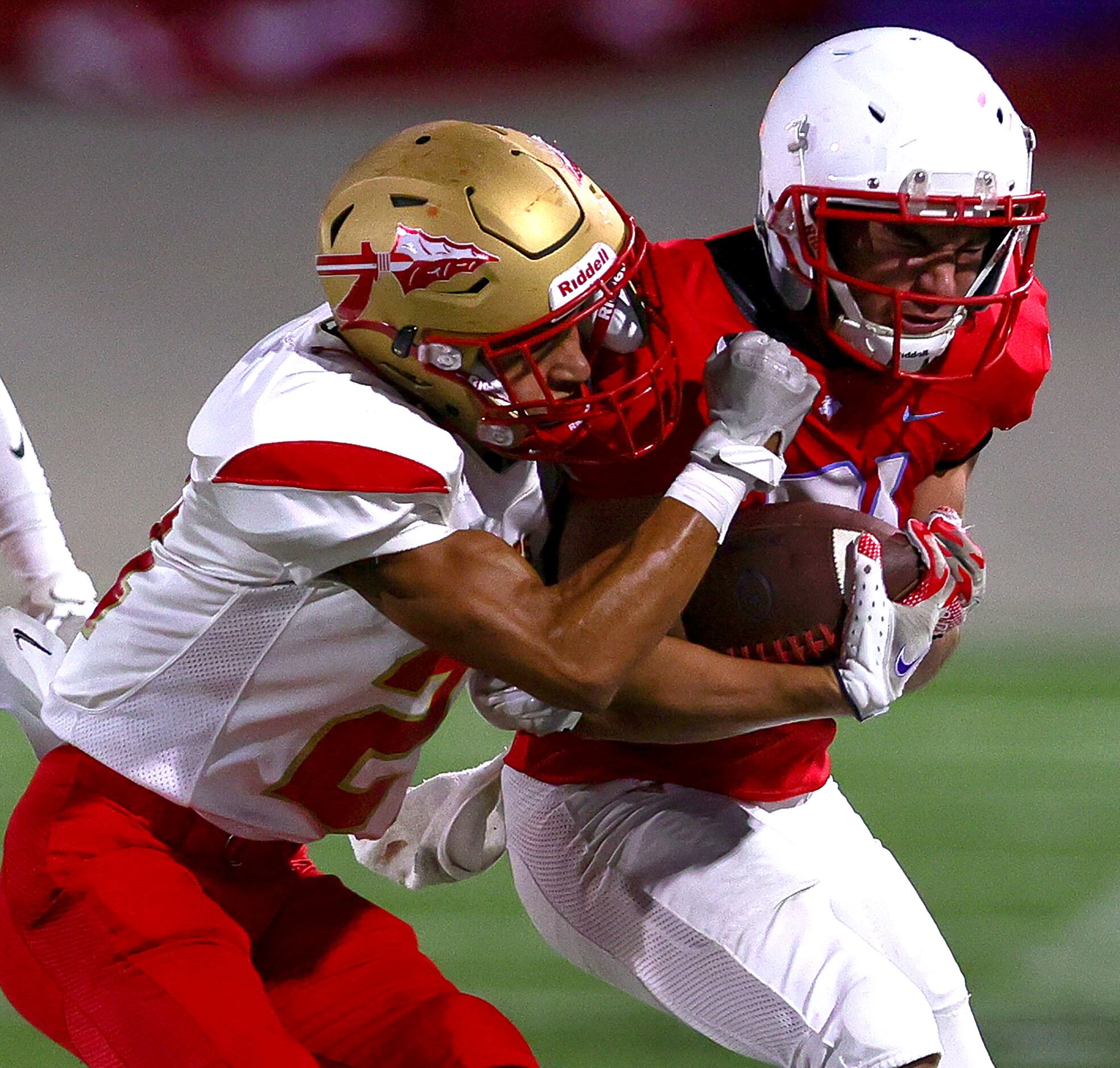 Skyline running back Joel Facundo (R) gets forced out of bounds by South Grand Prairie...