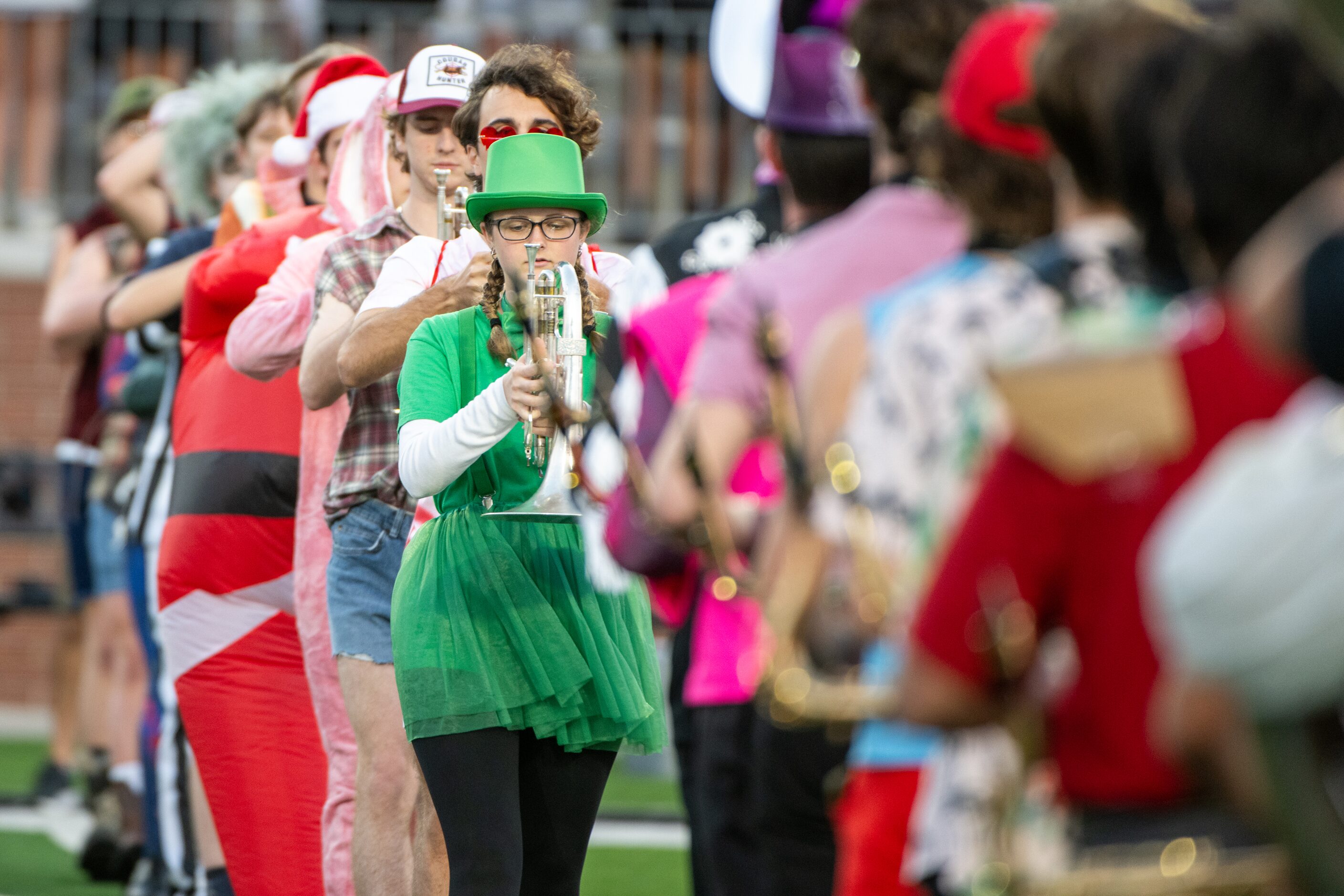 Members of the Allen Eagle Escadrille march onto the field in their Halloween costumes...