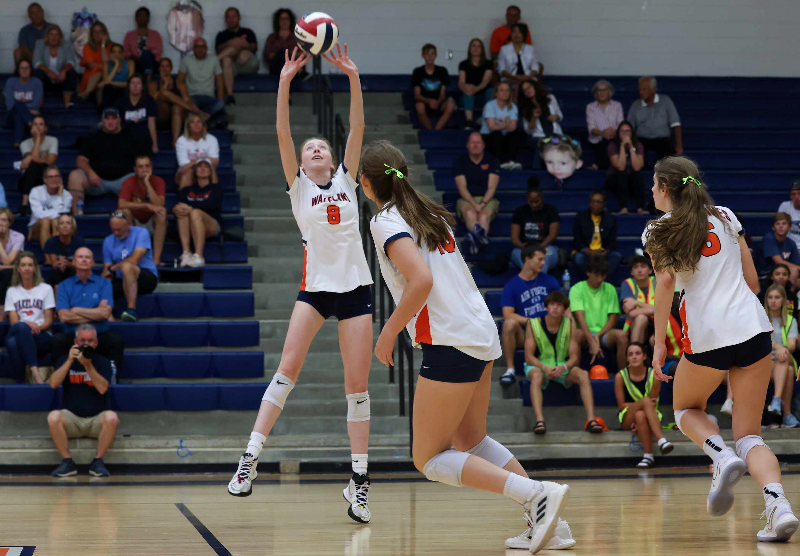 Frisco ISD’s Wakeland High School Sarah Pfiffner (8) sets the ball during the second set of...