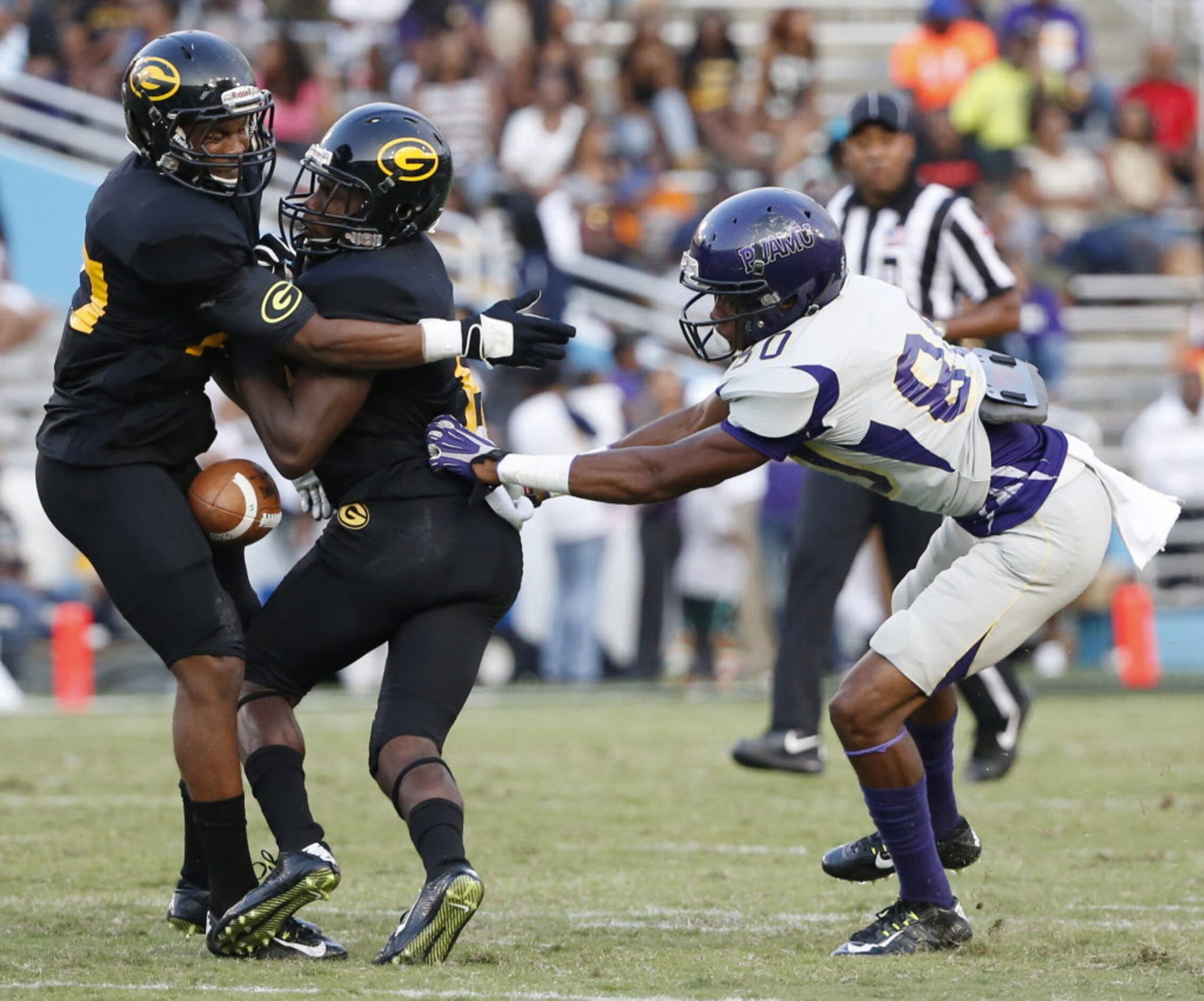 Grambling State defensive back Tyree Hollins (27) collides with defensive back Mike Roach...