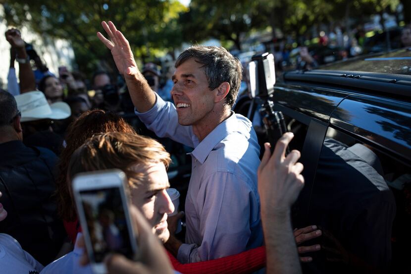 Rep. Beto O'Rourke waves to supporters as he leaves a campaign event in Dallas on Nov. 2,...