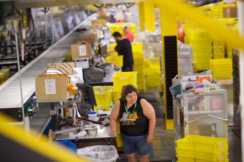 ROBBINSVILLE, NJ - AUGUST 2:  Amazon employees work at the Amazon Fulfillment Center on...