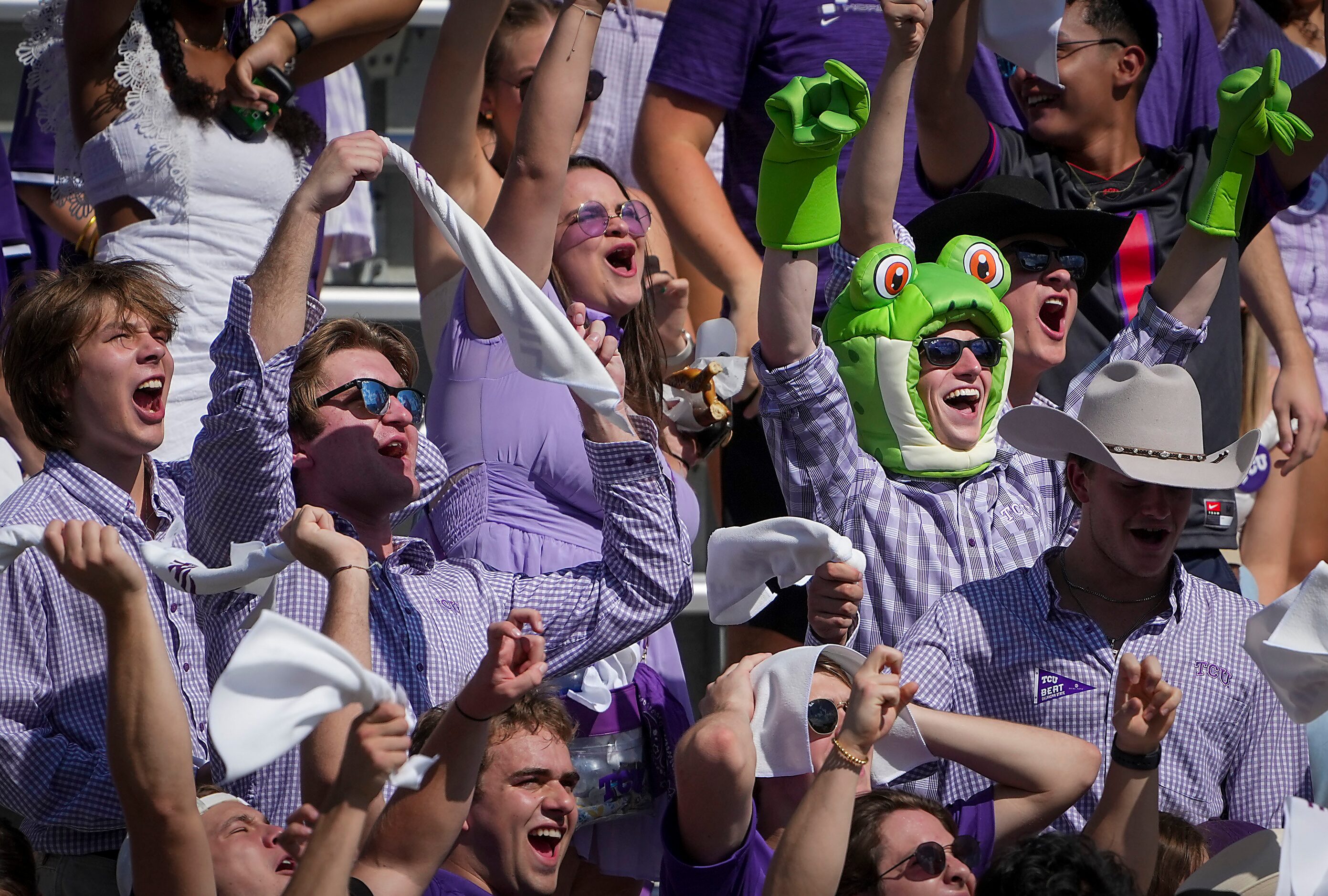 TCU fans cheer their team before an NCAA football game against Oklahoma State on Saturday,...