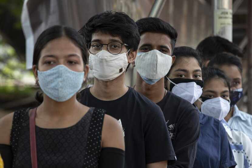 Indian youth above eighteen years age queue up to get vaccinated against the coronavirus in...