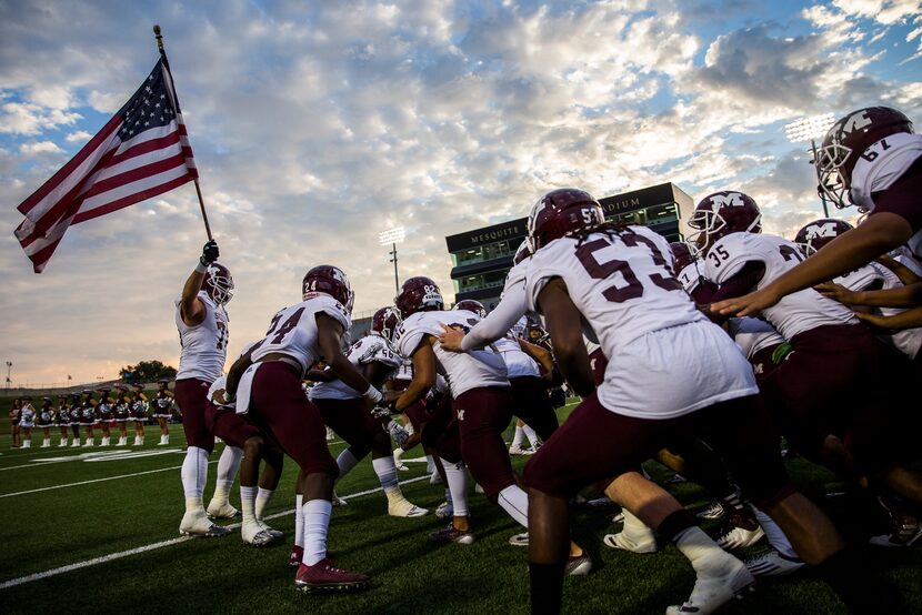 Mesquite football players prepare to take the field before  their game against Mesquite Horn...