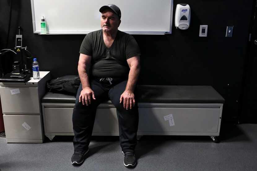 David Colbath rests after practicing shooting using an active shooter simulation video for...
