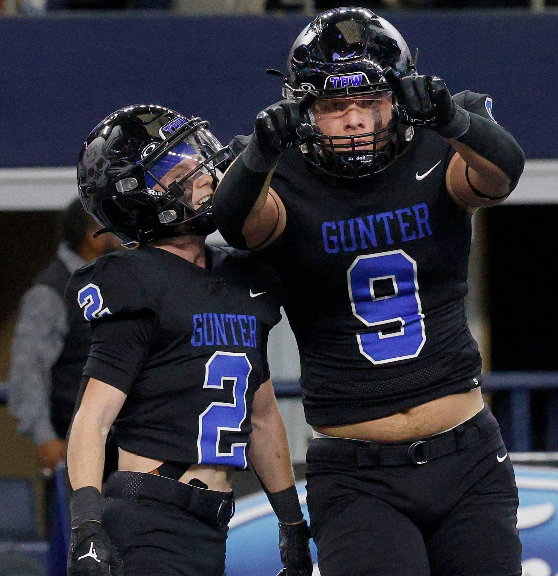 Gunter's  Cole Harpole (9) celebrates with his teammate Gunter's  Easton Overman (2) after...