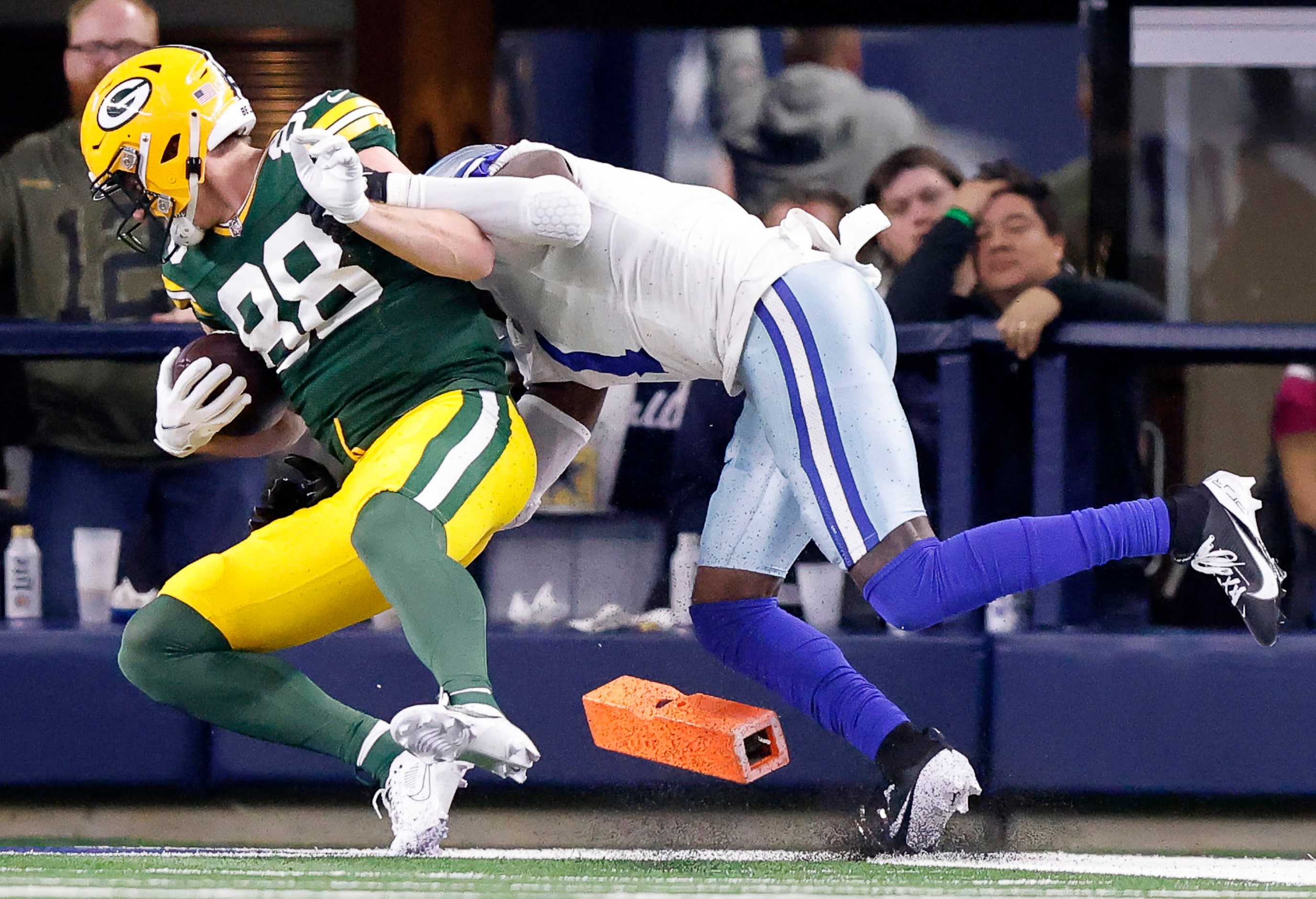 Green Bay Packers tight end Luke Musgrave (88) scores a third quarter touchdown as he is...