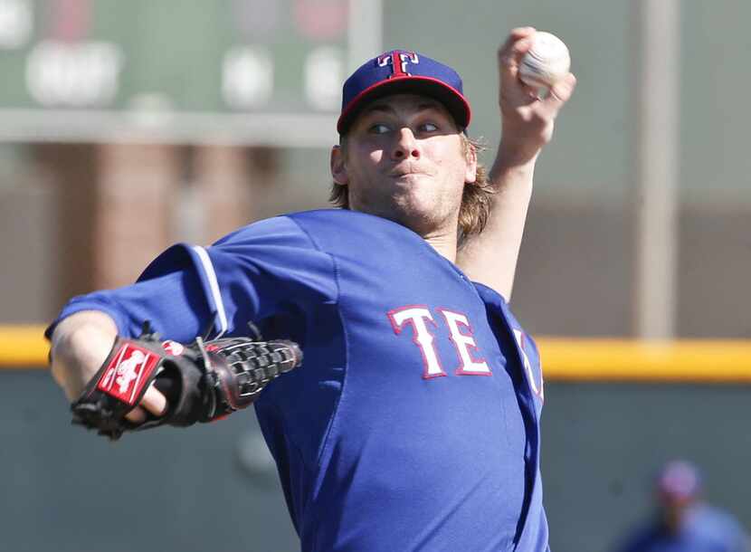 Texas Rangers relief pitcher Ross Detwiler works in a intrasquad game prior to a spring...