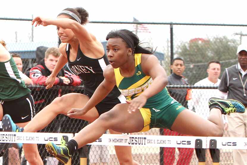 DeSoto hurdler Alexis Duncan set a Region I meet record on her way to winning the 100...