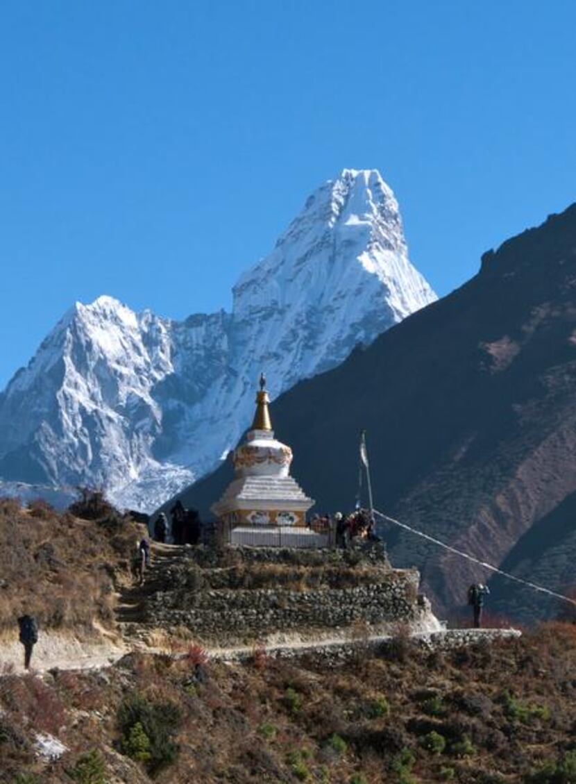 
A chorten echoes the stunning shape of Ama Dablam, considered by many to be the most...