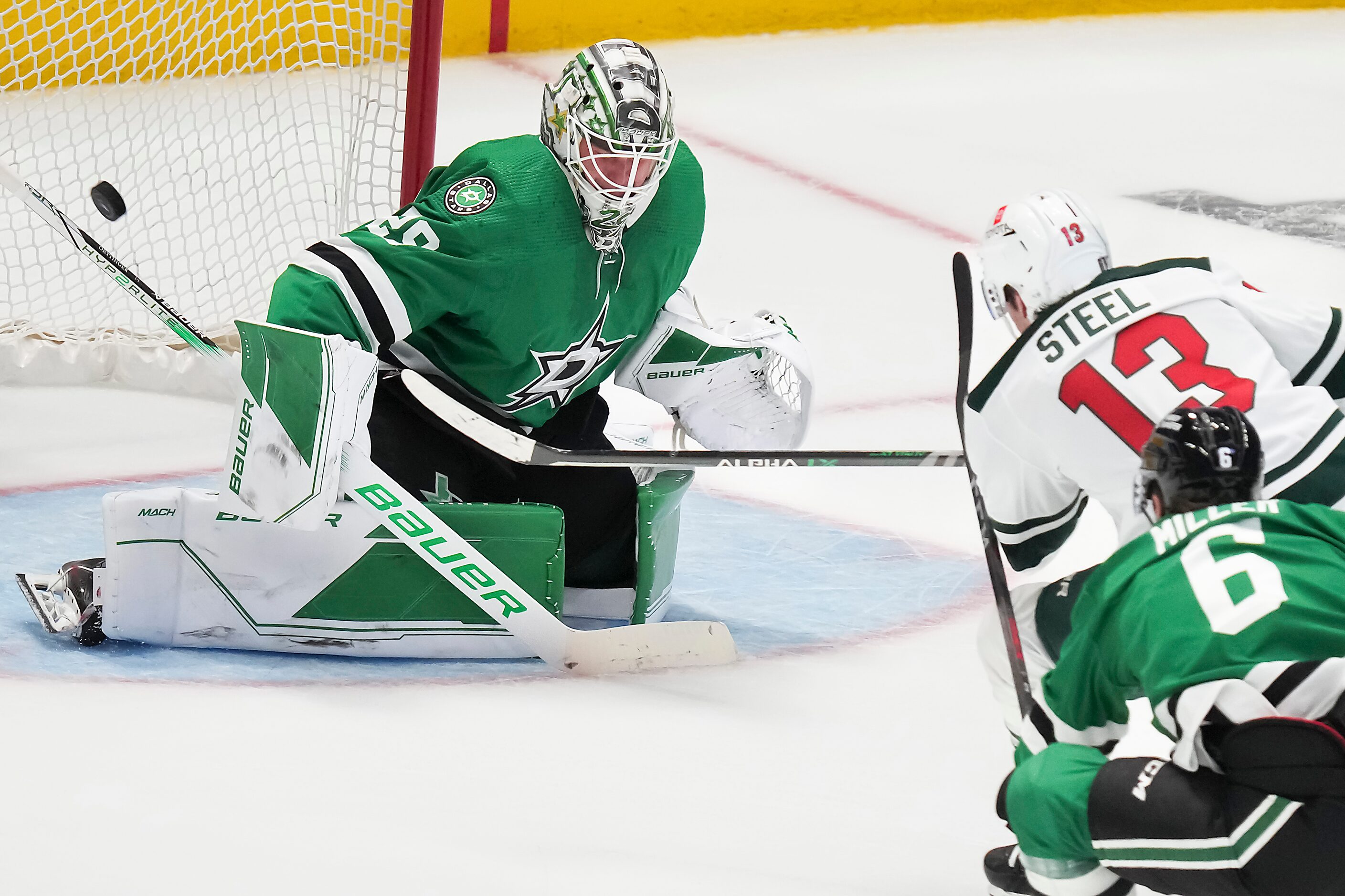 Minnesota Wild center Sam Steel (13) beats Dallas Stars goaltender Jake Oettinger (29) for a...