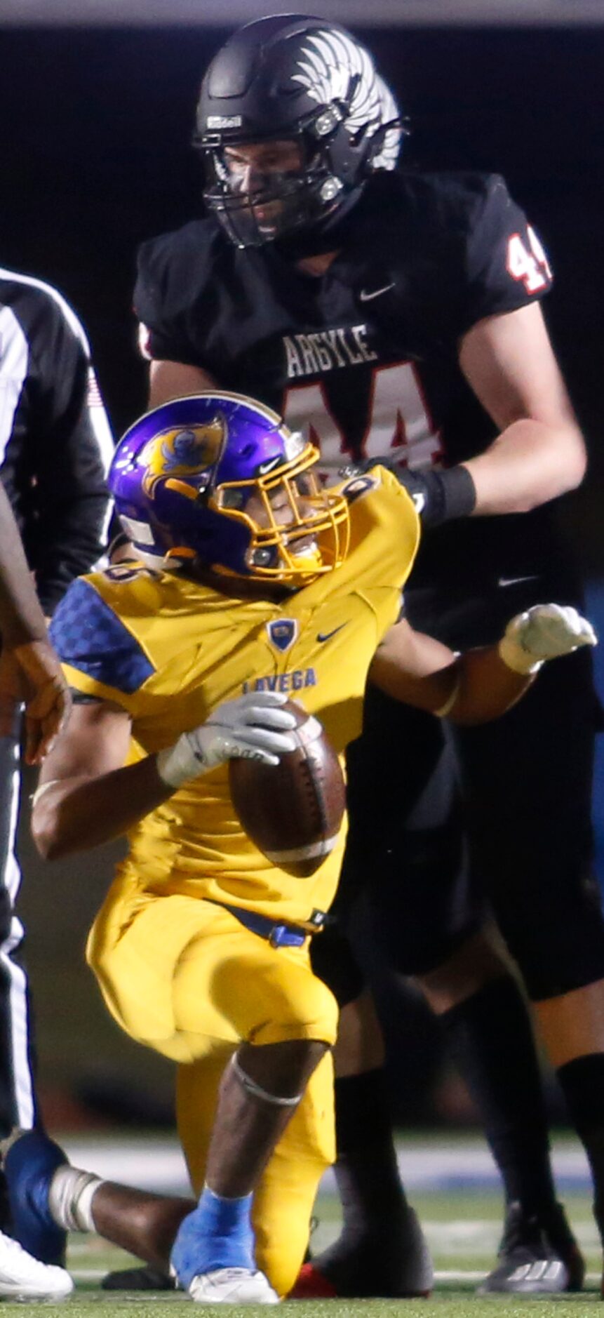 Argyle defensive lineman Riley Van Poppel (44) assists Waco LaVega's Jar'quae Walton (6)...