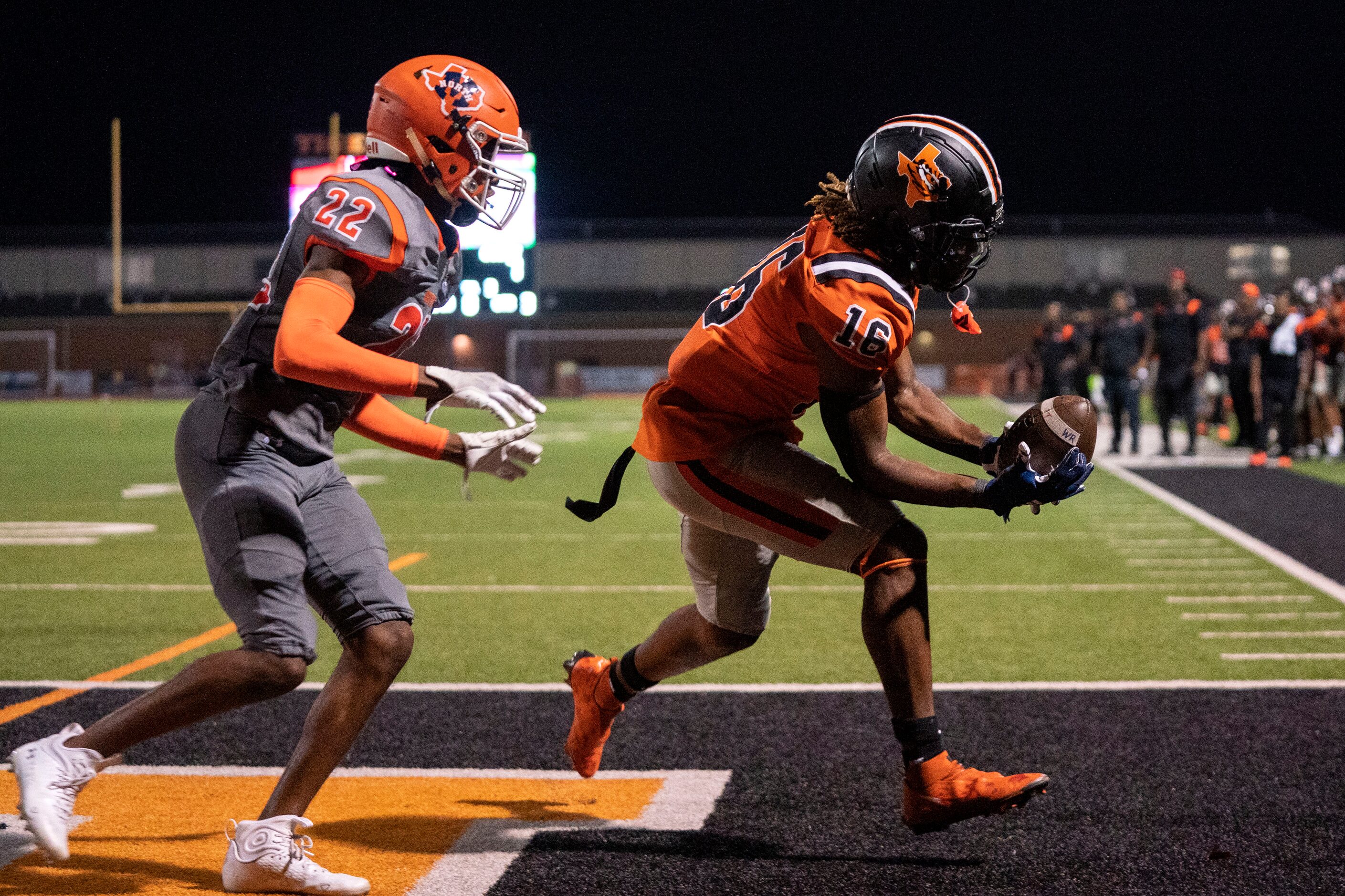 Lancaster senior wide receiver Daylin Jordan (16) hauls in a touchdown reception in front of...