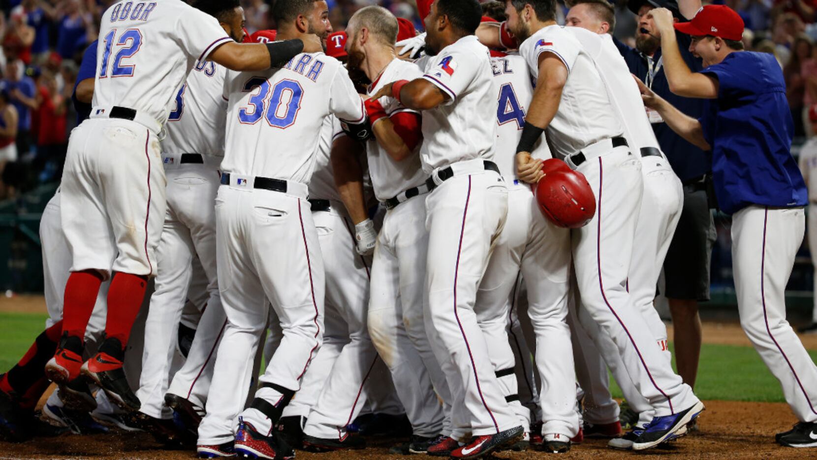 The Texas Rangers celebrate first baseman Mike Napoli's (5) 3-run home run against the San...