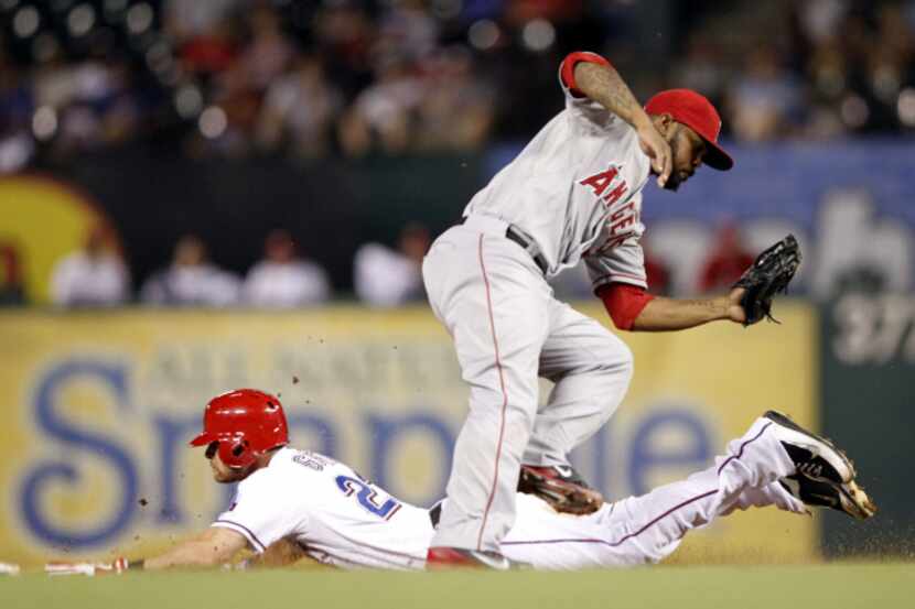 Cleveland Indians right fielder Shin-Soo Choo (17) is caught stealing by Texas Rangers...