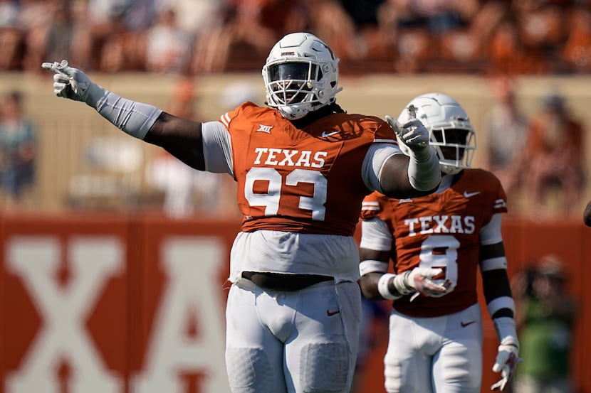 Texas defensive lineman T'Vondre Sweat (93) reacts during the second half of an NCAA college...