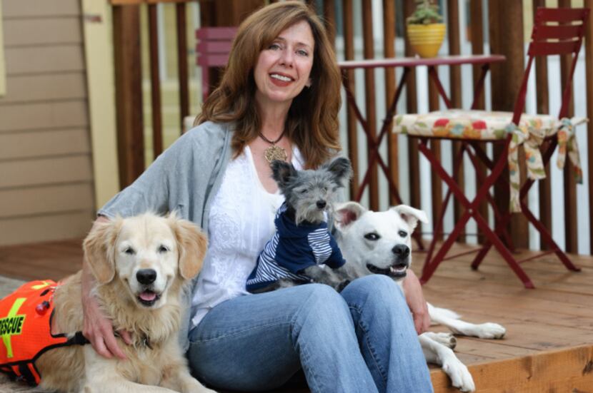 Susannah Charleson, with  Puzzle (the golden), Ollie (on her lap), and Jake Piper.